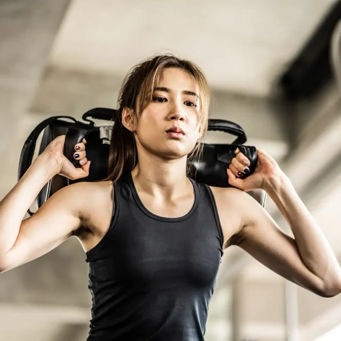 beautiful-young-woman-exercising-gym