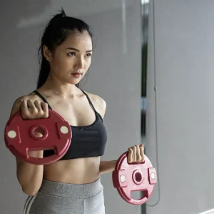 women-exercising-with-two-dumbbell-weight-plates